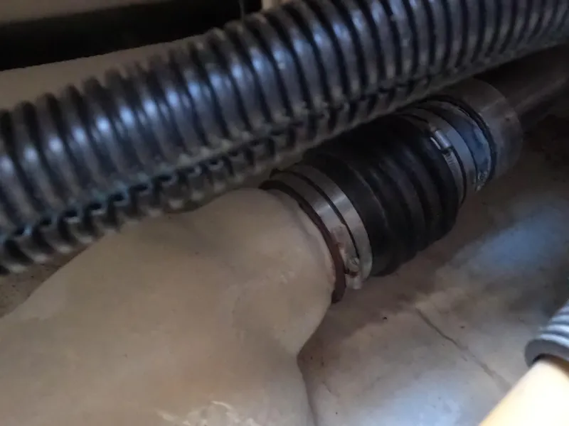 Slide: The Image of Close-up of 2004 Tiara Yachts 4400 Sovran engine compartment hoses and clamps. - 43