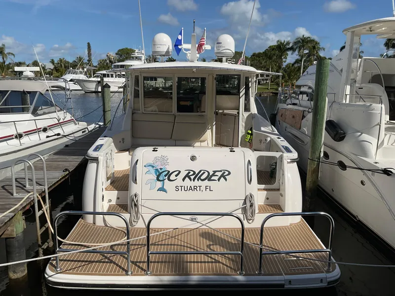 Slide: The Image of 2004 Tiara Yachts 4400 Sovran docked in marina, rear view. - 46