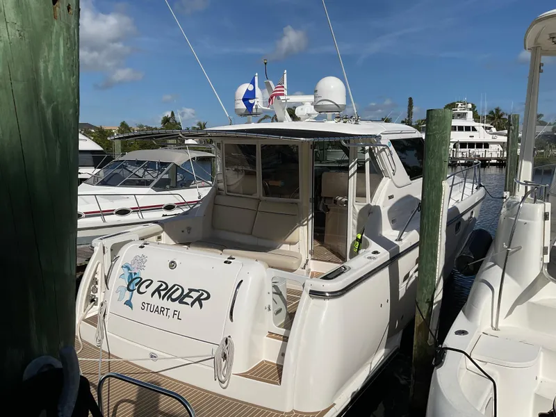 Slide: The Image of 2004 Tiara Yachts 4400 Sovran docked in sunny marina, Stuart, FL. - 47