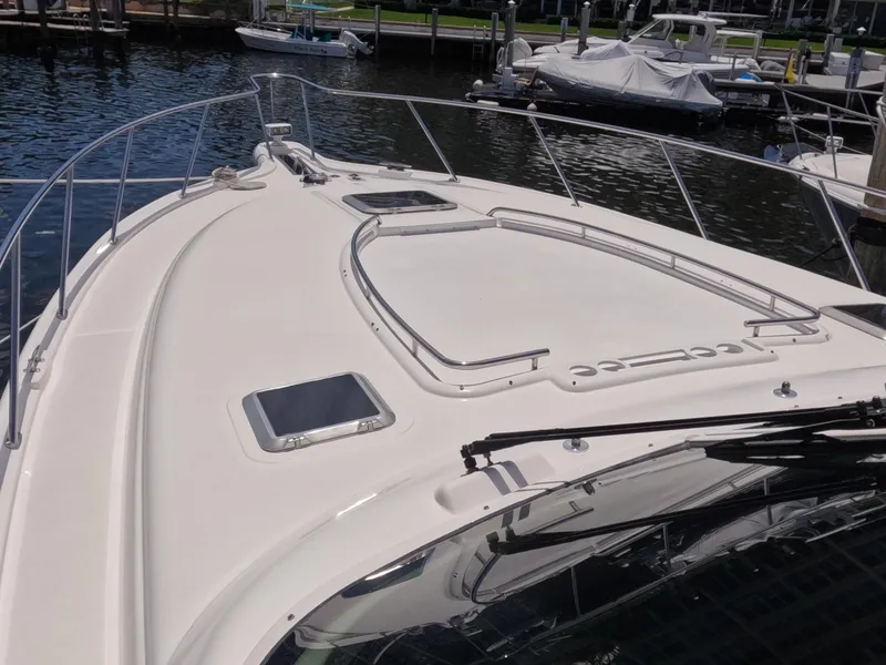 Slide: The Image of 2004 Tiara Yachts 4400 Sovran boat deck, docked in a marina. - 55