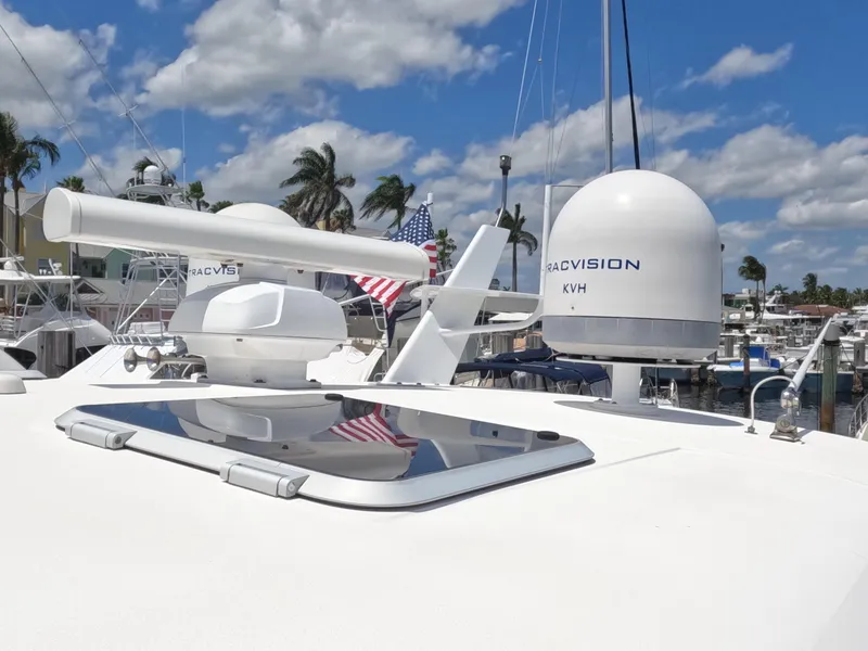 Slide: The Image of Tiara Yachts 4400 Sovran 2004 with marine electronics and radar, docked under blue sky. - 56