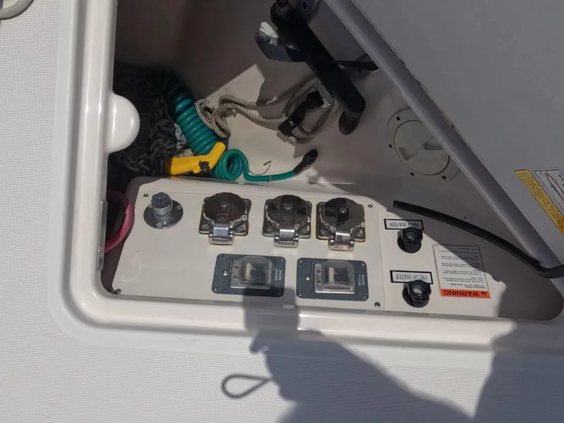 Slide: The Image of 2004 Tiara Yachts 4400 Sovran electrical panel with cables and switches. - 58
