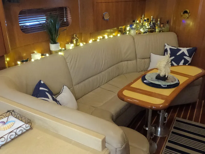 Slide: The Image of Luxurious 2004 Tiara Yachts 4400 Sovran interior with cozy seating and elegant decor. - 6
