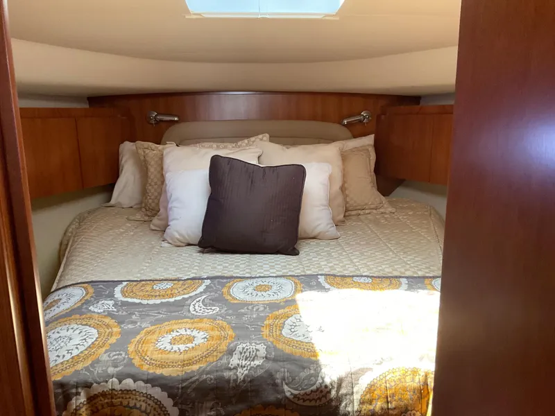 Slide: The Image of Luxurious cabin interior of 2004 Tiara Yachts 4400 Sovran with cozy bedding. - 8
