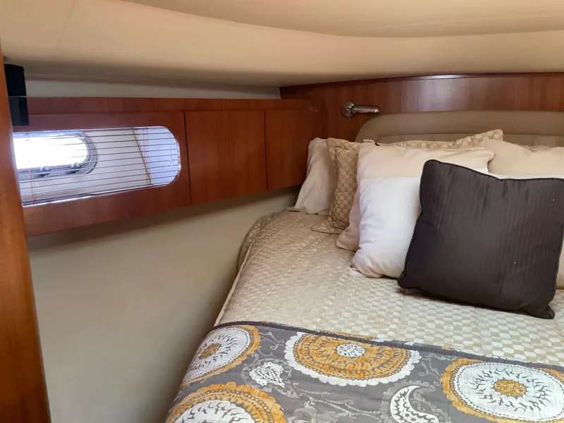 Slide: The Image of Luxurious cabin interior of 2004 Tiara Yachts 4400 Sovran with elegant bedding. - 9