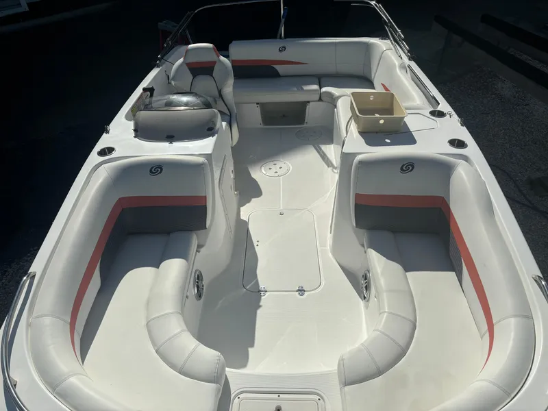 Slide: The Image of 2021 Hurricane 188 SunDeck Sport CC-OB boat interior with white seating and red accents. - 4
