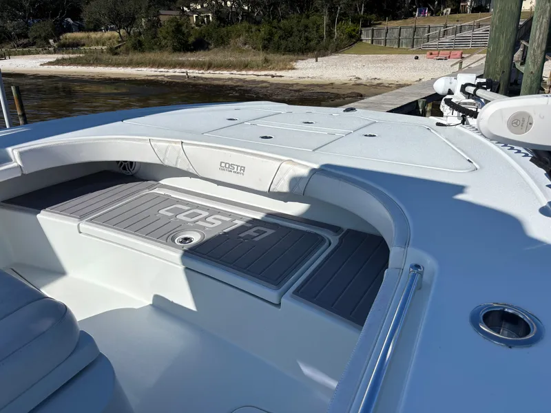 Slide: The Image of 2022 Costa Custom Boats 264HC deck, featuring spacious seating and sleek design. - 13