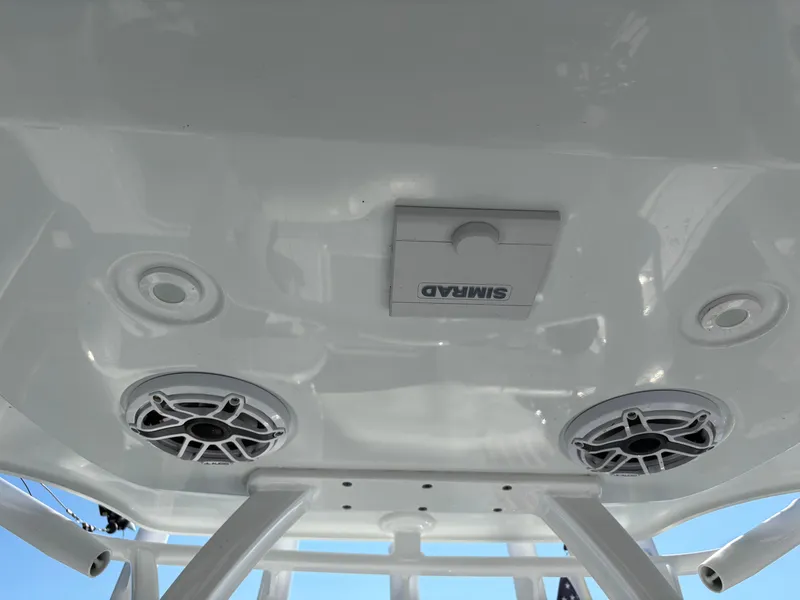 Slide: The Image of 2022 Costa Custom Boats 264HC ceiling with speakers and Simrad equipment. - 27