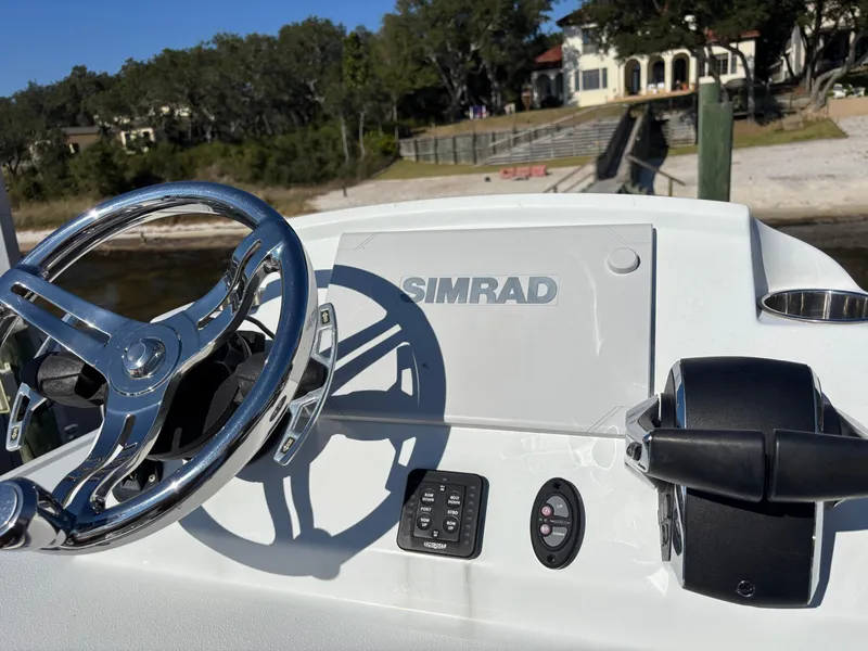 Slide: The Image of Steering console of 2022 Costa Custom Boats 264HC with Simrad display. - 30