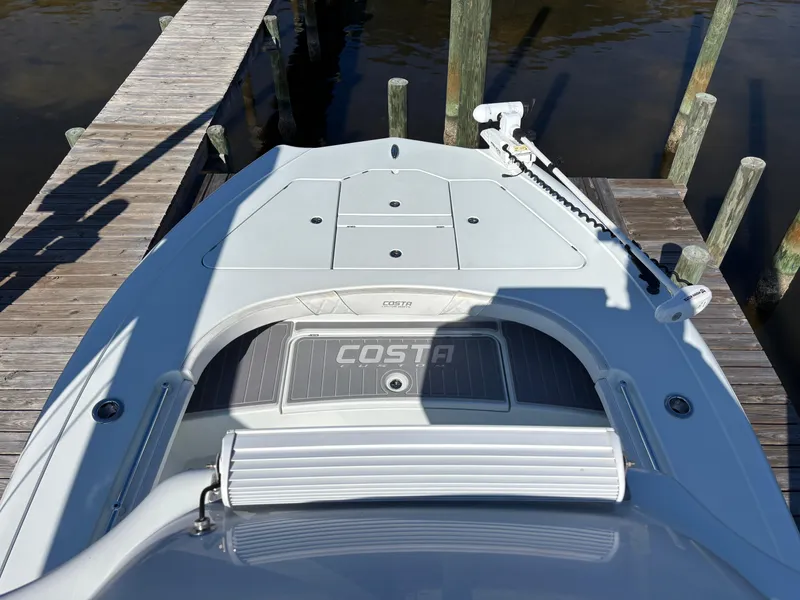 Slide: The Image of 2022 Costa Custom Boats 264HC docked, showcasing sleek design and modern features. - 35