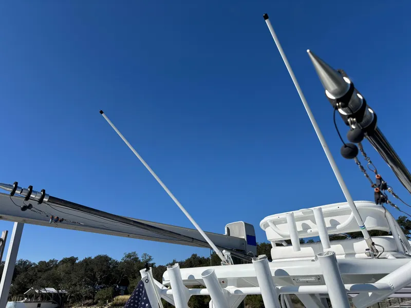 Slide: The Image of Costa Custom Boats 264HC 2022 model with antennas against clear blue sky. - 41