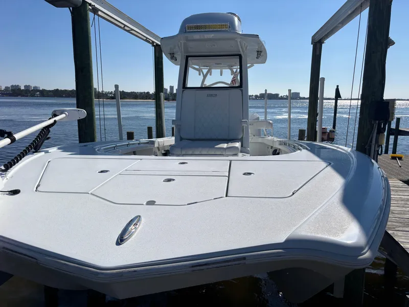 Slide: The Image of 2022 Costa Custom Boats 264HC on water, showcasing sleek design and spacious deck. - 6