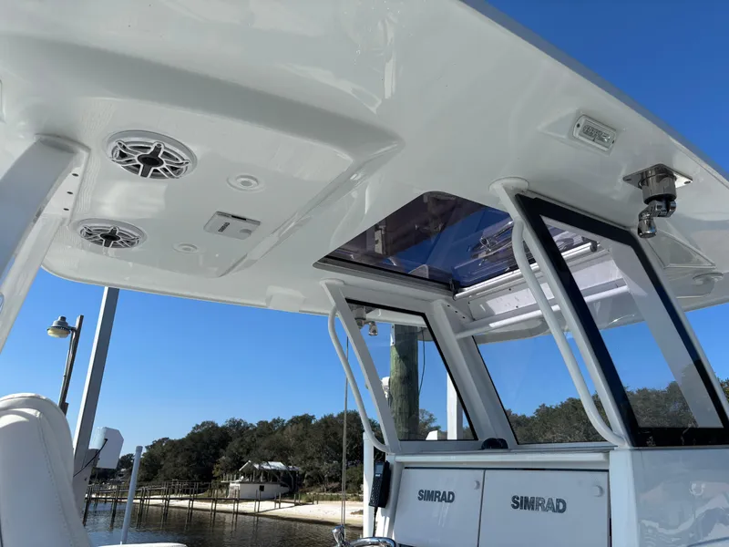 Slide: The Image of 2022 Costa Custom Boats 264HC with Simrad electronics, sleek design, and spacious cabin. - 8