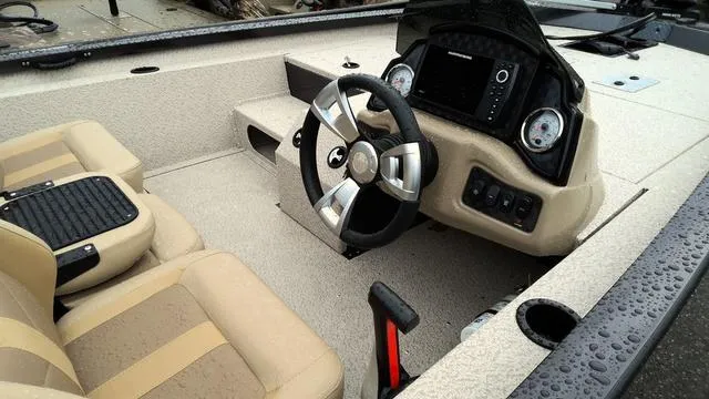 Slide: The Image of 2025 G3 Sportsman 1710 boat interior with steering wheel and dashboard controls. - 4