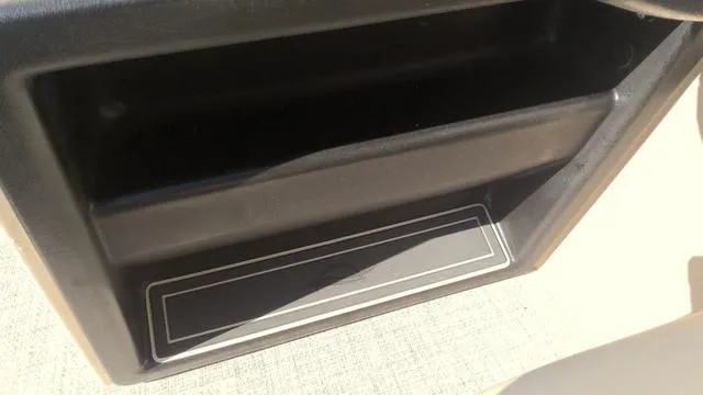 Slide: The Image of Storage compartment in 2025 SunCatcher Select 324SL boat interior. - 12