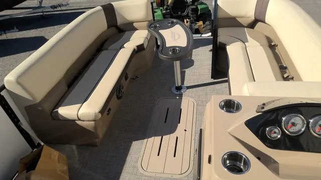 Slide: The Image of Interior of 2025 SunCatcher Select 324SL pontoon boat with beige seating and dashboard. - 19