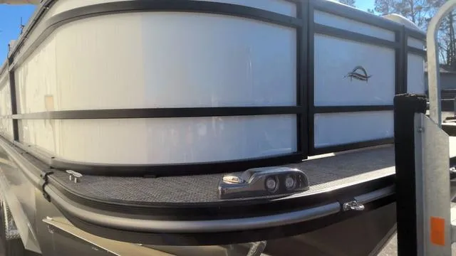 Slide: The Image of 2025 SunCatcher Select 324SL pontoon boat, sleek design, close-up view. - 20