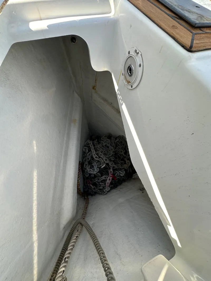 Slide: The Image of Anchor locker of 2013 Jeanneau 57 sailboat with chain and rope. - 21