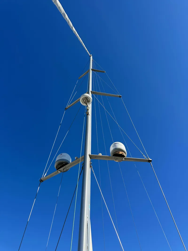 Slide: The Image of Mast of 2013 Jeanneau 57 sailboat against clear blue sky. - 24