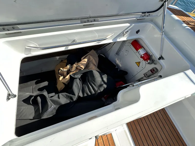 Slide: The Image of Storage compartment on a 2013 Jeanneau 57 yacht with safety equipment and gear. - 34