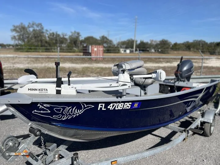 Slide: The Image of 2018 G3 Guide V150 T boat with Minn Kota motor on trailer. - 12