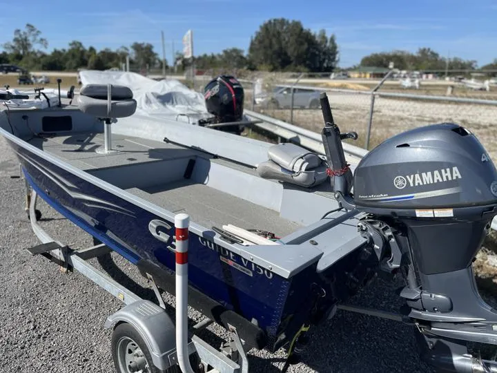 Slide: The Image of 2018 G3 Guide V150 T boat with Yamaha motor on trailer. - 2