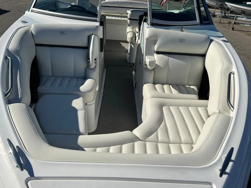 Slide: The Image of 2014 Cobalt R5 boat interior with white leather seating and spacious layout. - 18