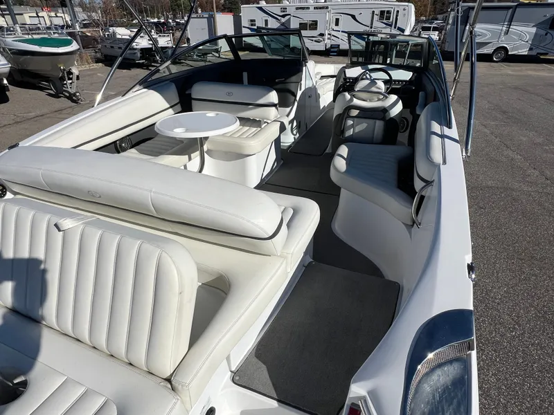 Slide: The Image of 2014 Cobalt R5 boat interior with white seating and steering wheel. - 22