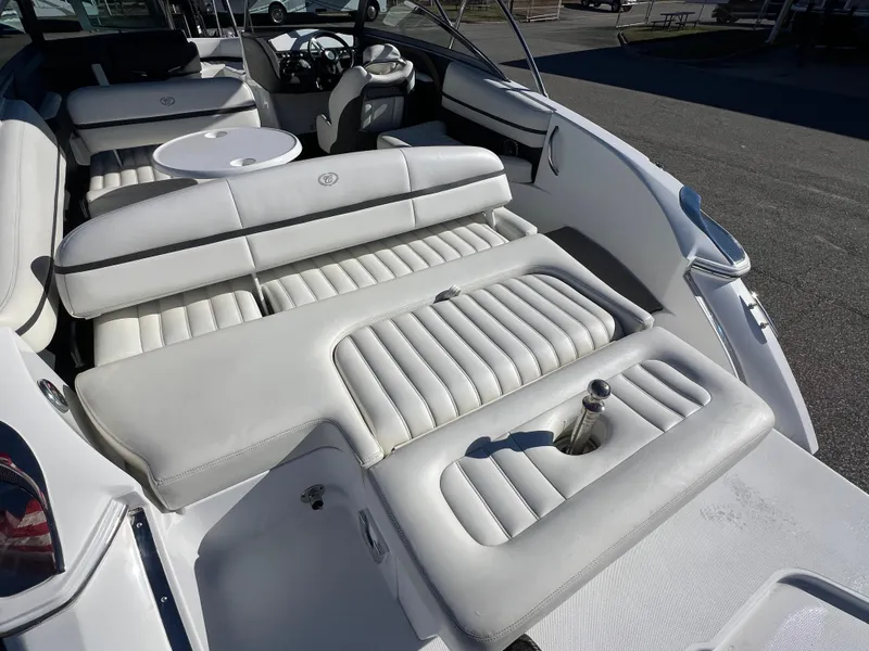 Slide: The Image of 2014 Cobalt R5 boat interior with white leather seating and steering wheel. - 24