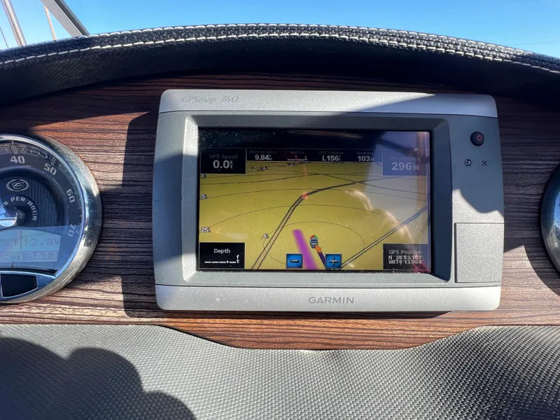 Slide: The Image of Garmin GPS display on 2014 Cobalt R5 dashboard with wood paneling. - 31
