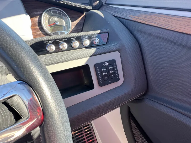 Slide: The Image of Dashboard of a 2014 Cobalt R5 boat with control panel and gauge. - 33
