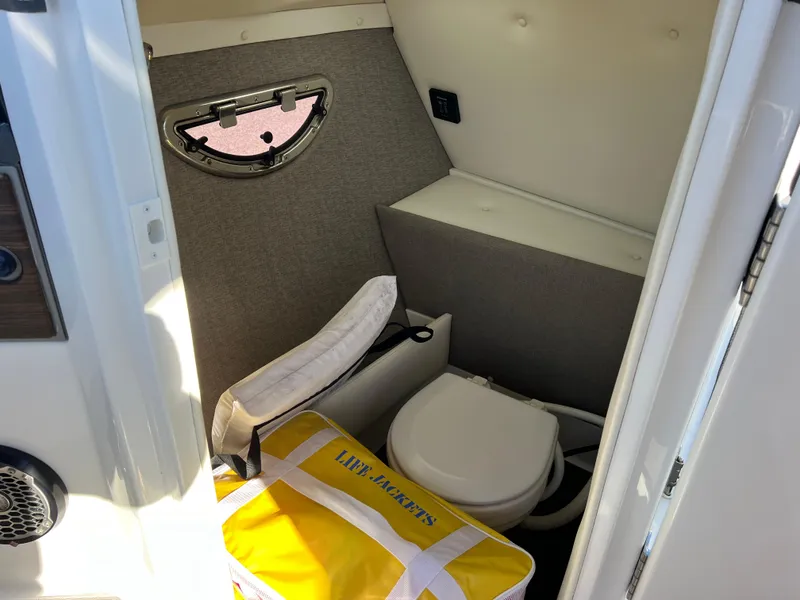 Slide: The Image of 2014 Cobalt R5 boat interior with toilet and life jackets. - 34