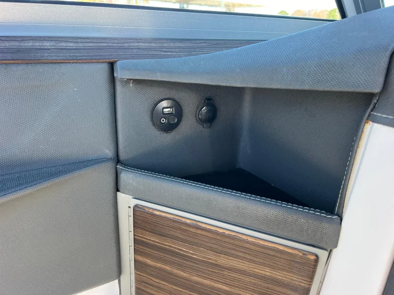 Slide: The Image of Interior detail of 2014 Cobalt R5, featuring storage compartment and USB port. - 36