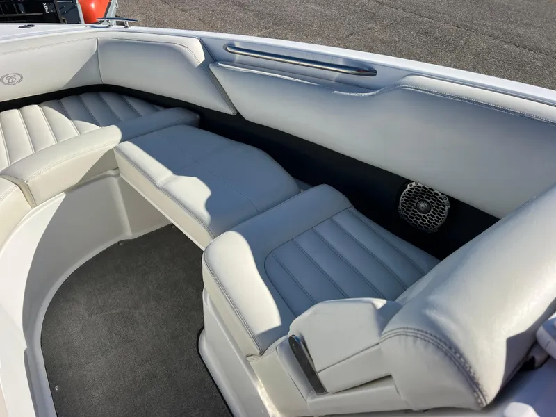 Slide: The Image of 2014 Cobalt R5 boat interior with white leather seating and speaker. - 38