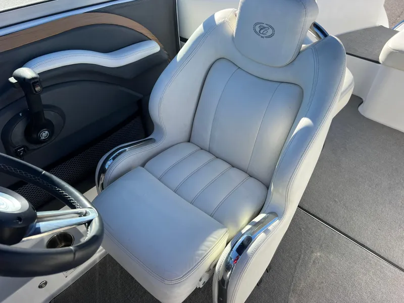 Slide: The Image of 2014 Cobalt R5 boat interior with luxurious white captain's seat and sleek design. - 40