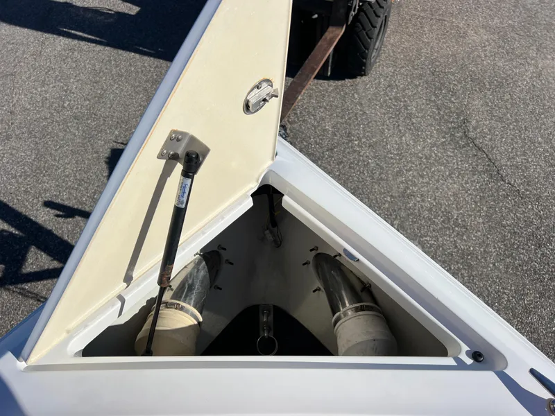Slide: The Image of Open storage compartment on 2014 Cobalt R5 boat, showing interior details. - 42