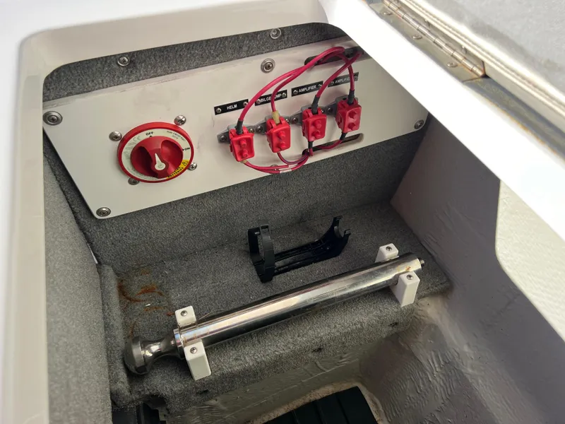 Slide: The Image of 2014 Cobalt R5 boat battery switch panel with wiring and components. - 46