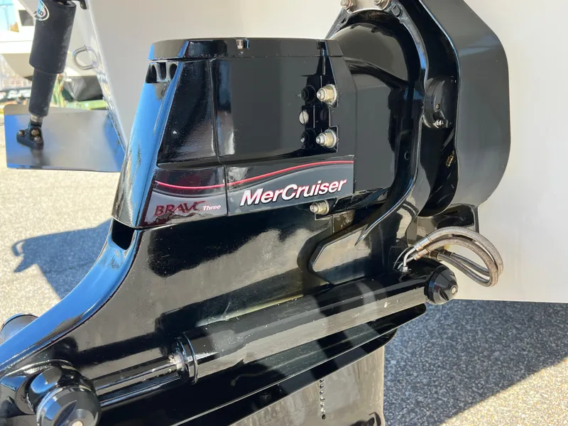 Slide: The Image of Close-up of 2014 Cobalt R5 boat's MerCruiser engine and trim tab. - 8