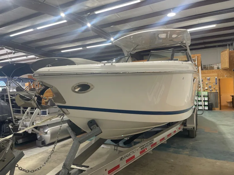 Slide: The Image of 2022 Cobalt 30 SC boat on trailer in indoor showroom. - 5