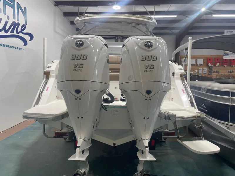 Slide: The Image of 2022 Cobalt 30 SC boat with dual Yamaha 300 V6 outboard engines in showroom. - 7