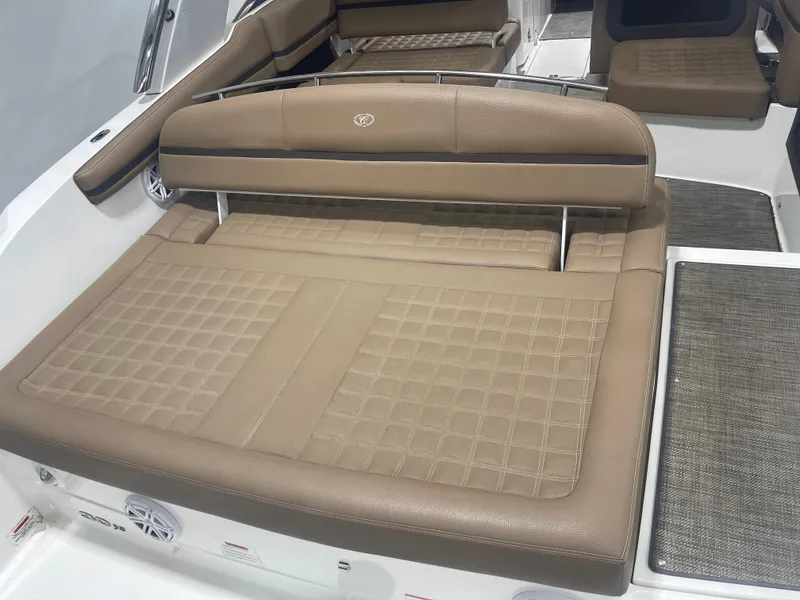 Slide: The Image of 2022 Cobalt 30 SC boat interior with tan leather seating and modern design. - 9