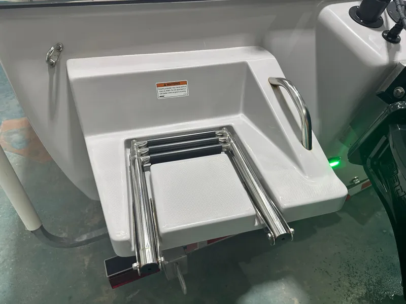 Slide: The Image of 2023 Sea Born FX 25 boat swim platform with retractable ladder and safety handle. - 12