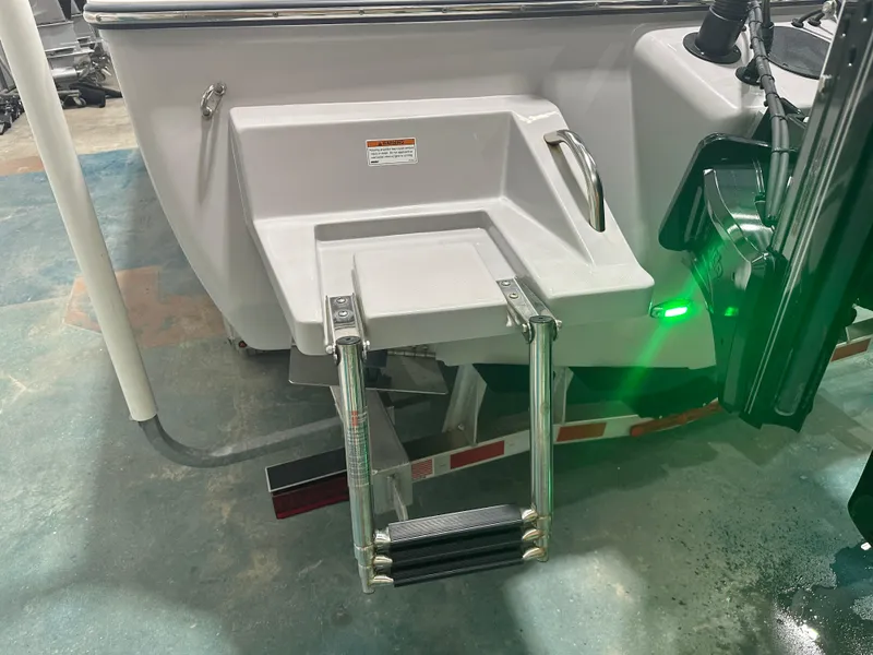 Slide: The Image of 2023 Sea Born FX 25 boat with swim platform and ladder. - 13