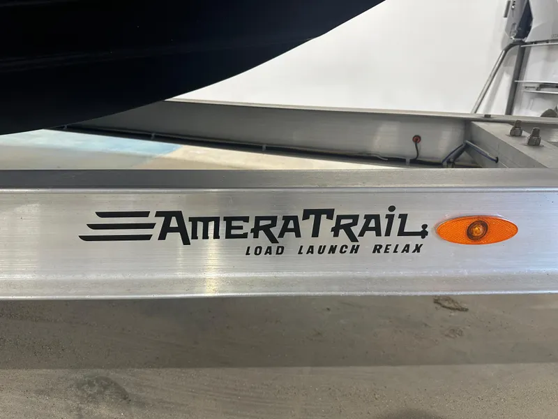 Slide: The Image of AmeraTrail boat trailer with "Load Launch Relax" slogan, compatible with 2023 Sea Born FX 25. - 16