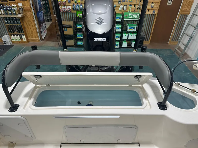 Slide: The Image of 2023 Sea Born FX 25 boat interior with Suzuki 350 engine in showroom. - 18