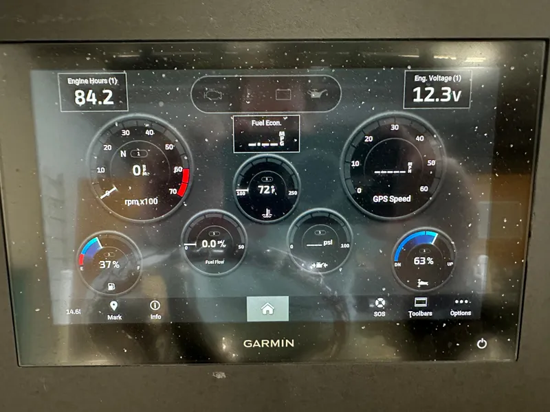 Slide: The Image of Garmin display showing Sea Born FX 25 engine metrics, including RPM, voltage, and fuel economy. - 22