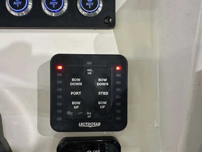 Slide: The Image of Control panel of 2023 Sea Born FX 25 boat with Lectrotab trim tab switches. - 24