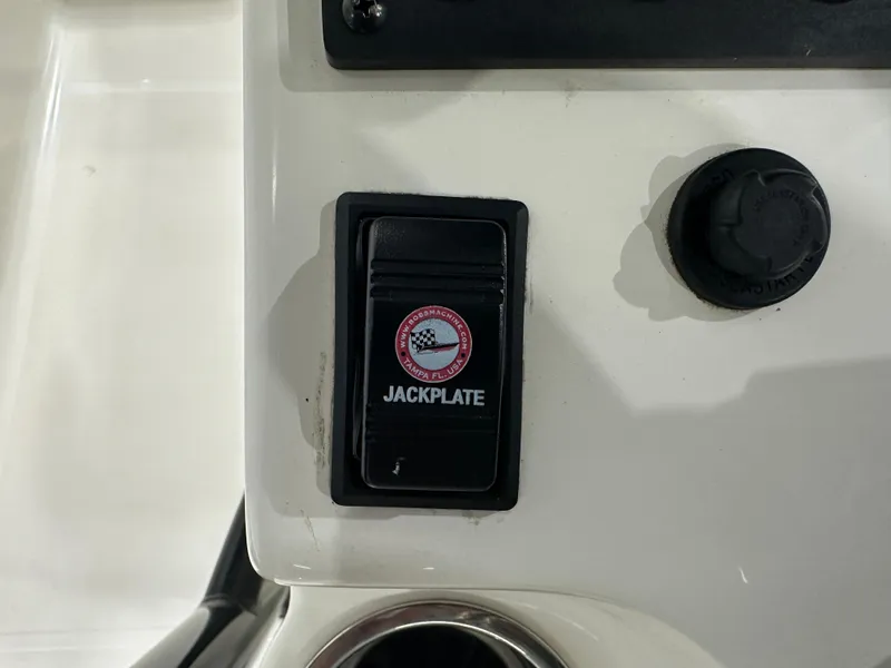 Slide: The Image of 2023 Sea Born FX 25 jackplate control switch on boat dashboard. - 26