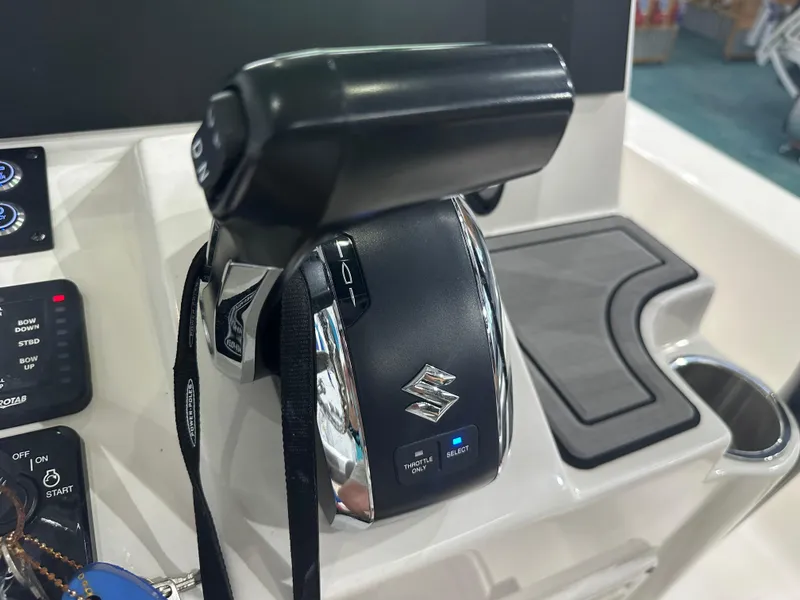 Slide: The Image of 2023 Sea Born FX 25 boat throttle control with Suzuki branding. - 27