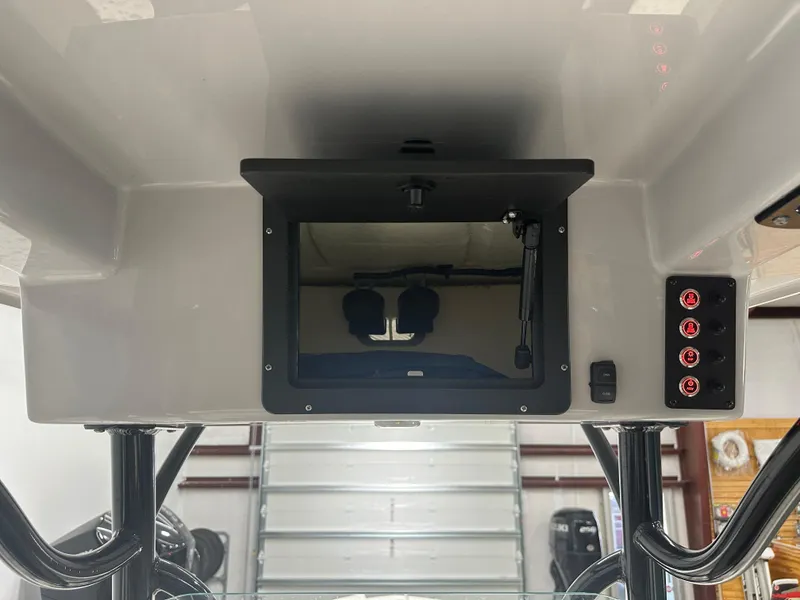 Slide: The Image of 2023 Sea Born FX 25 boat console with control panel and storage compartment. - 28
